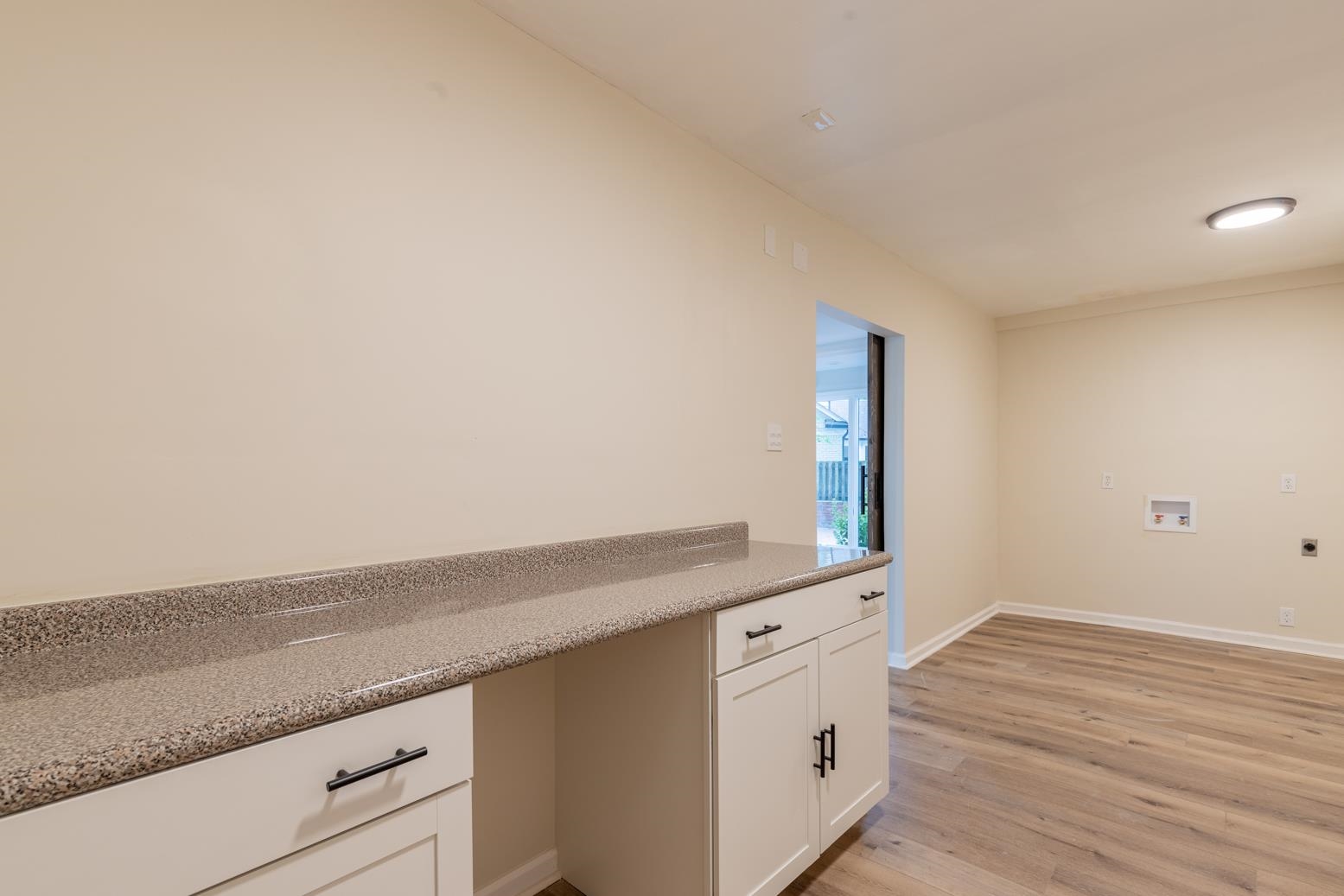 505 Thorn Ridge Cove Memphis, TN 38117 - Photo 20 of 31 Interior space with white cabinets and light hardwood / wood-style flooring