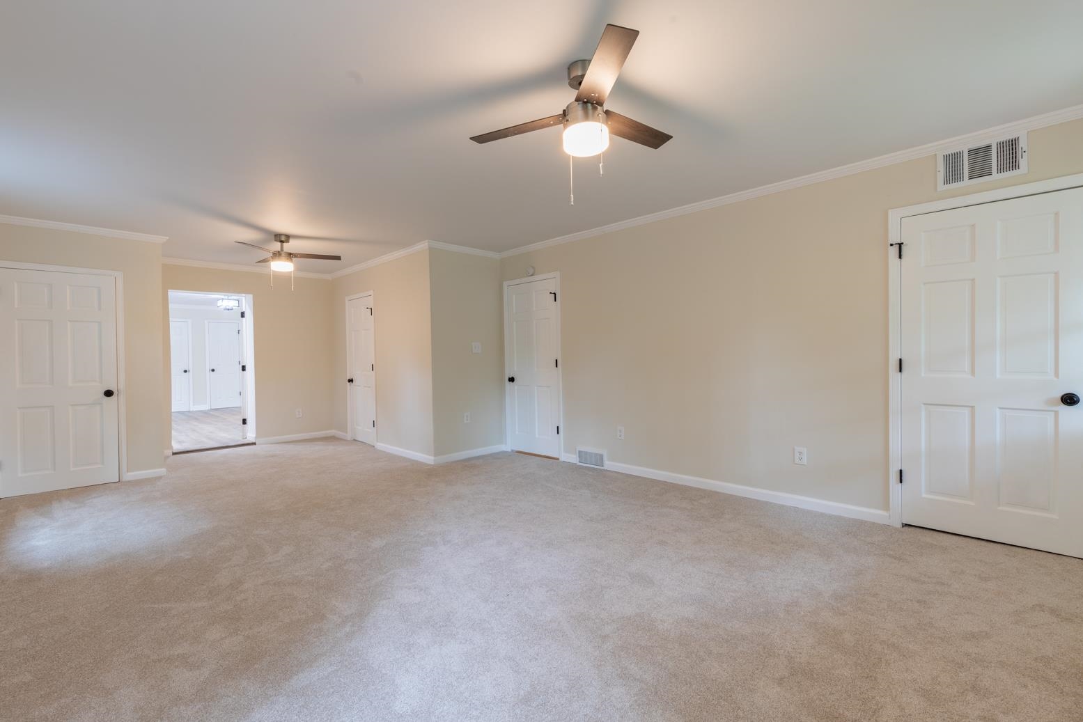 505 Thorn Ridge Cove Memphis, TN 38117 - Photo 29 of 31 Empty room with ceiling fan, carpet floors, and crown molding