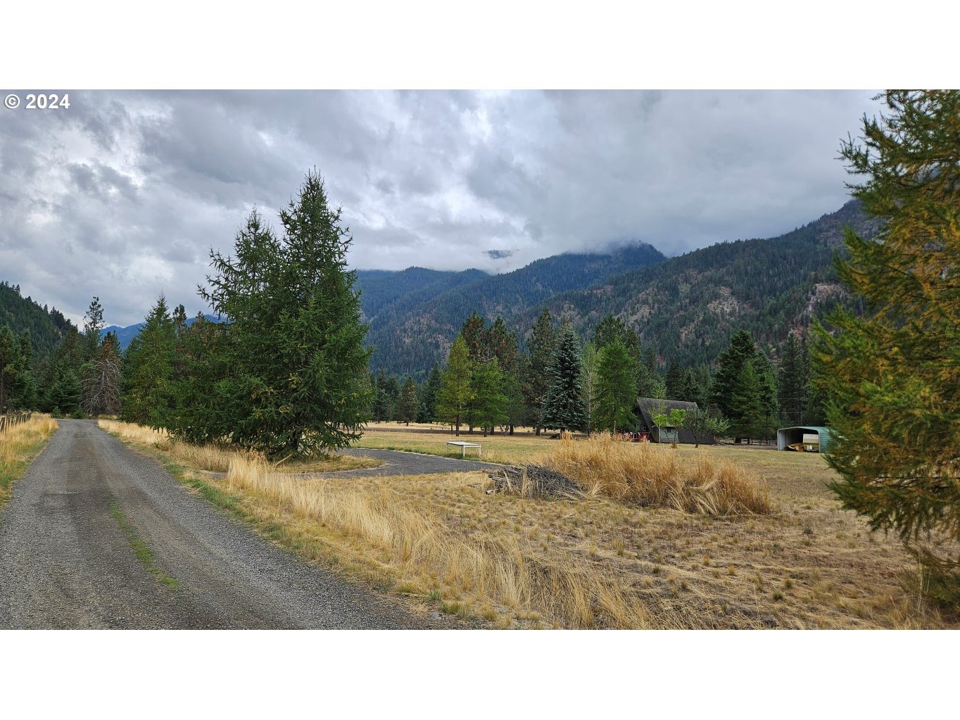 64940 Fir Road Lostine, OR 97857 - Photo 6 of 7 a open area with mountains in the back
