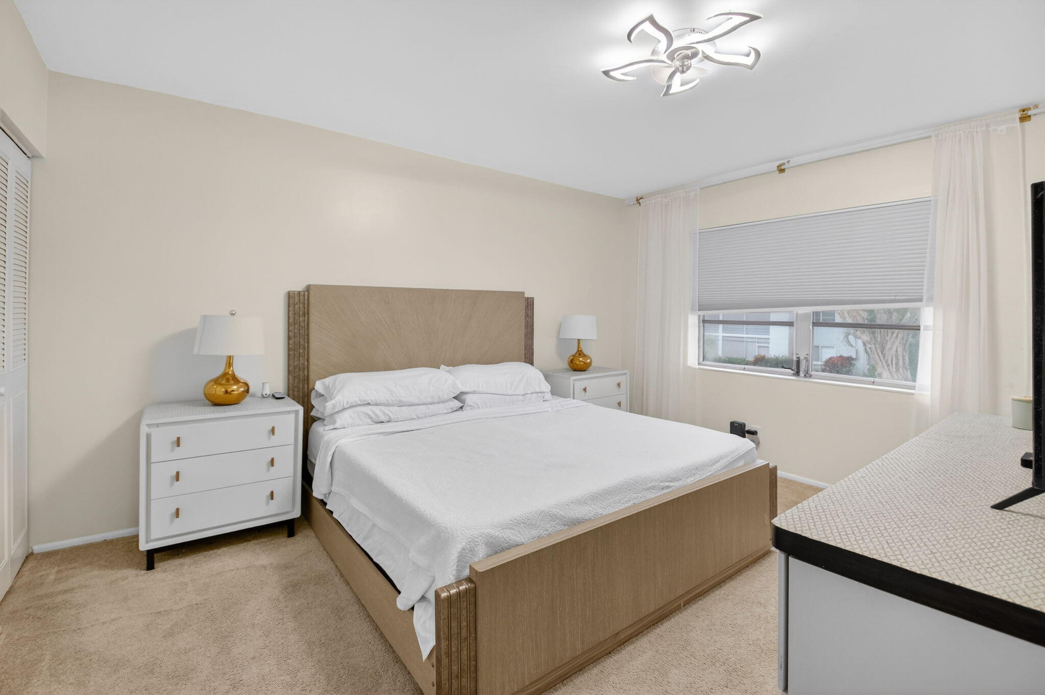 2340 Southwest 22nd Avenue, Unit 312 Delray Beach, FL 33445 - Photo 18 of 45 a bedroom with a bed and a window