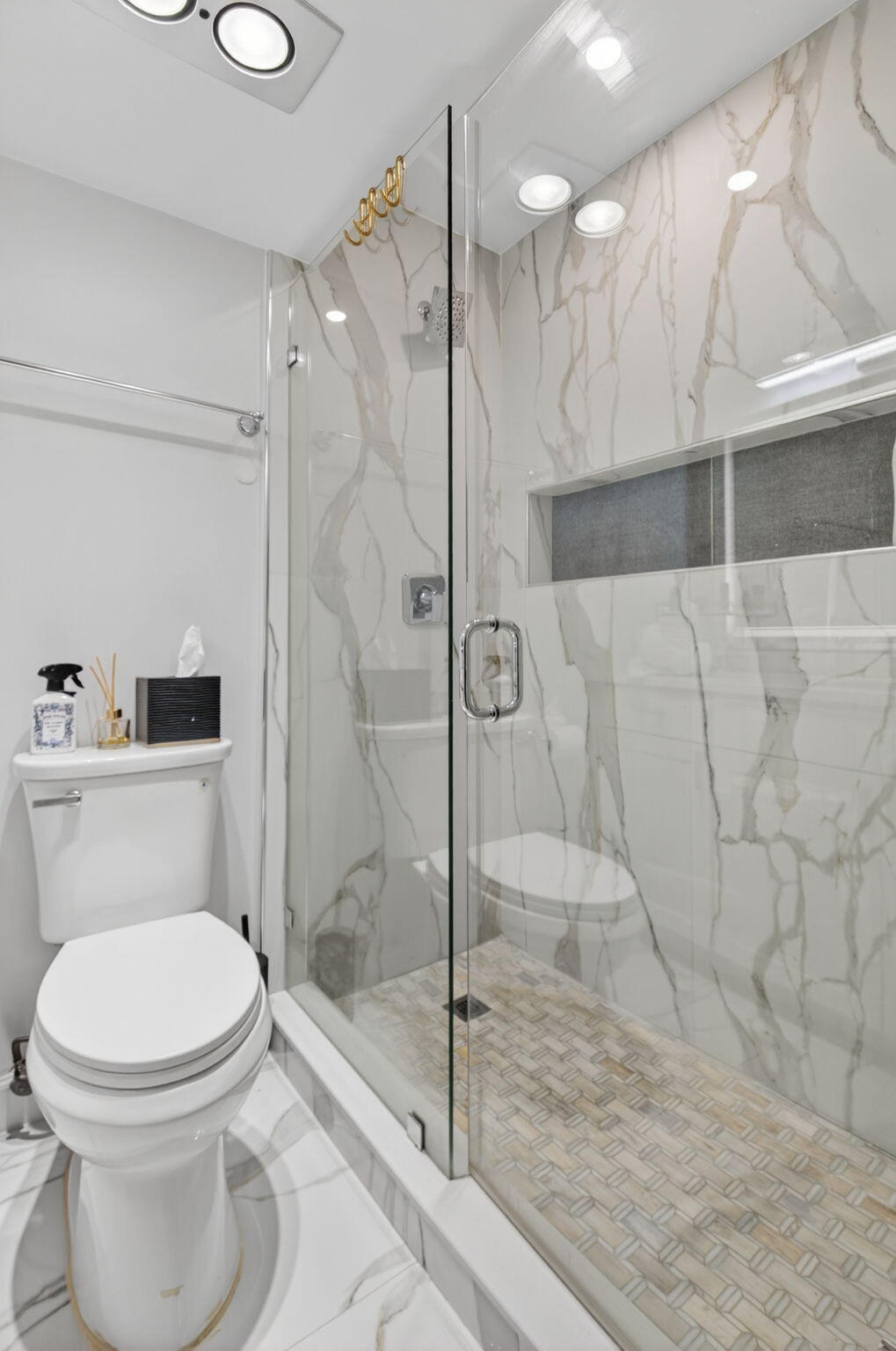 2340 Southwest 22nd Avenue, Unit 312 Delray Beach, FL 33445 - Photo 25 of 45 a bathroom with a toilet and a shower
