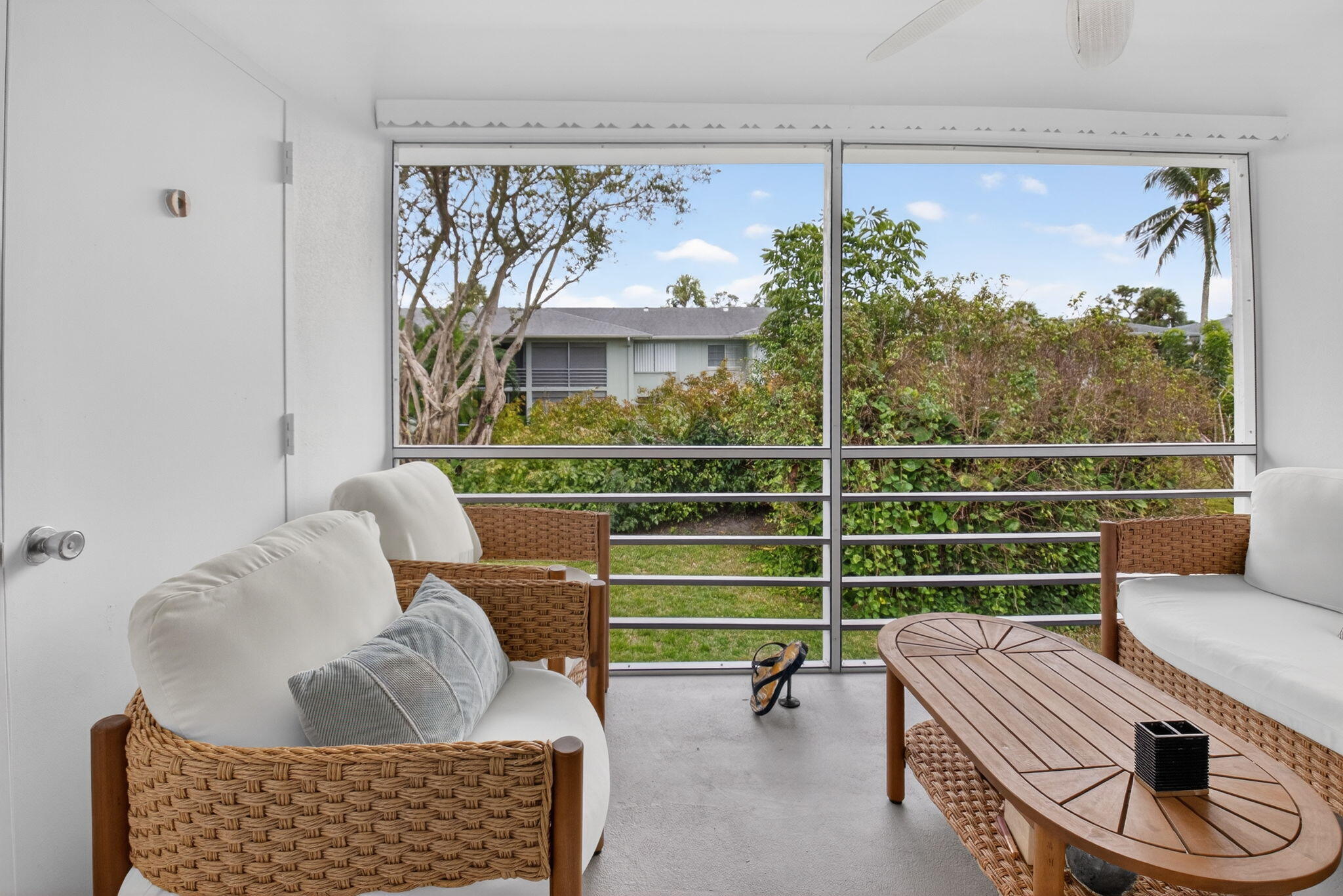 2340 Southwest 22nd Avenue, Unit 312 Delray Beach, FL 33445 - Photo 27 of 45 a room with furniture and a window