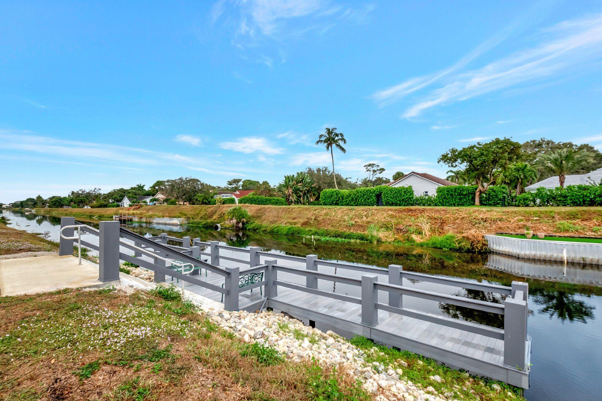 2340 Southwest 22nd Avenue, Unit 312 Delray Beach, FL 33445 - Photo 31 of 45 a view of a swimming pool with a yard