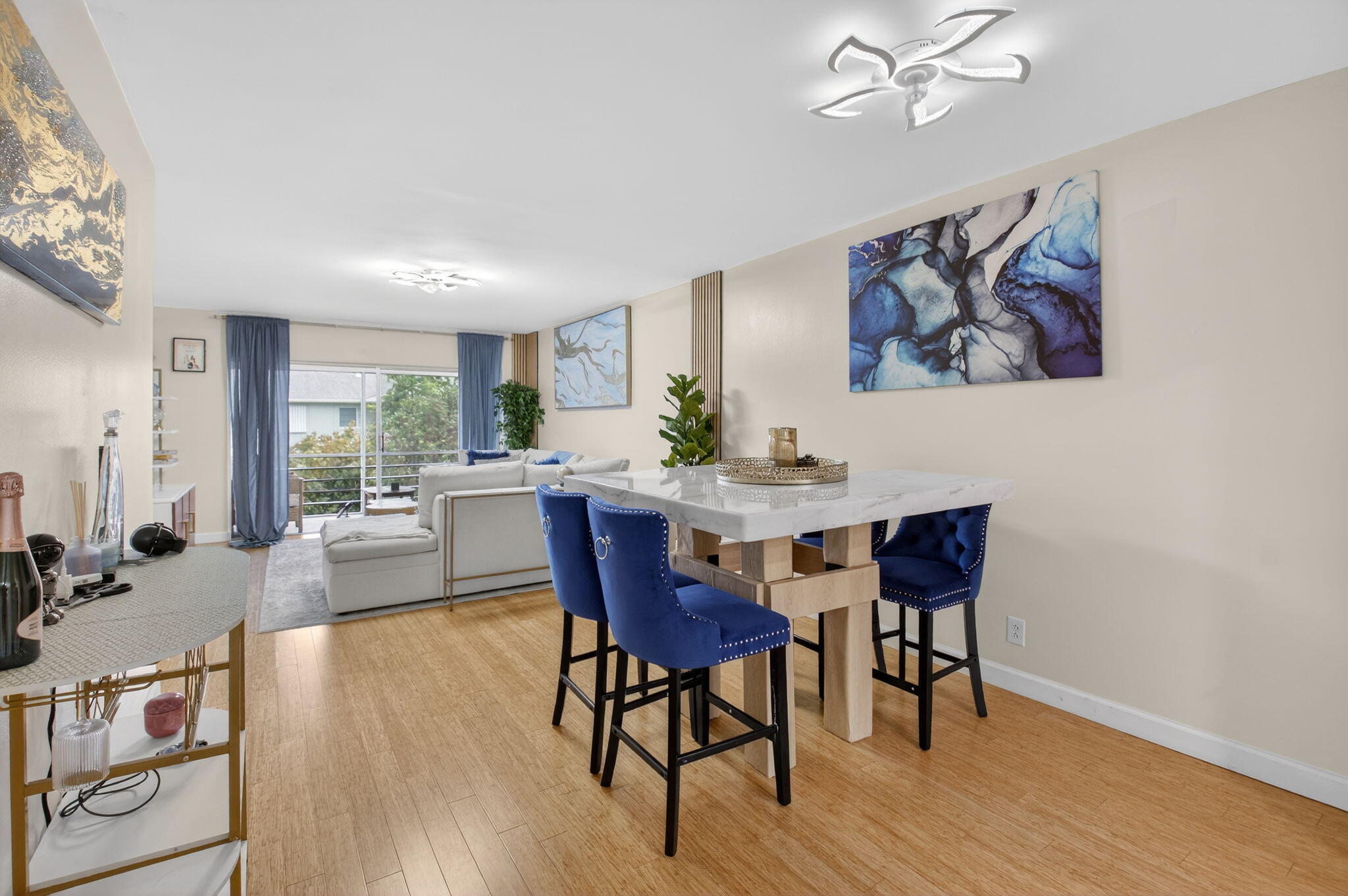 2340 Southwest 22nd Avenue, Unit 312 Delray Beach, FL 33445 - Photo 10 of 45 a view of a dining room with furniture window and wooden floor