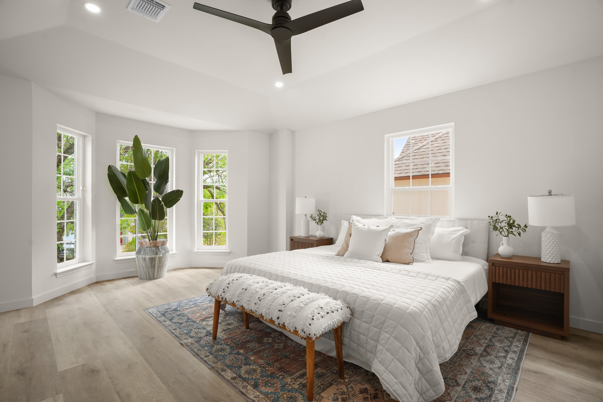 7826 Wheel Rim Circle Austin, TX 78749 - Photo 12 of 38 Hardwood floors and tall windows define this peaceful bedroom retreat.