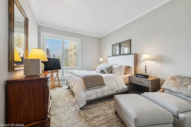 a bedroom with two beds and a window