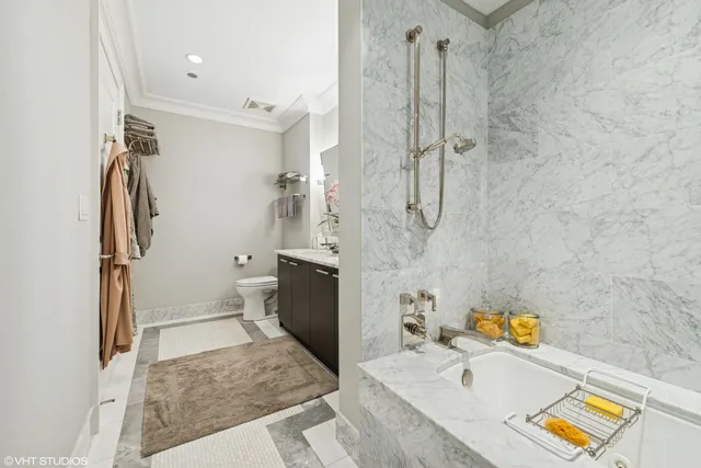 a bathroom with a tub sink and a shower