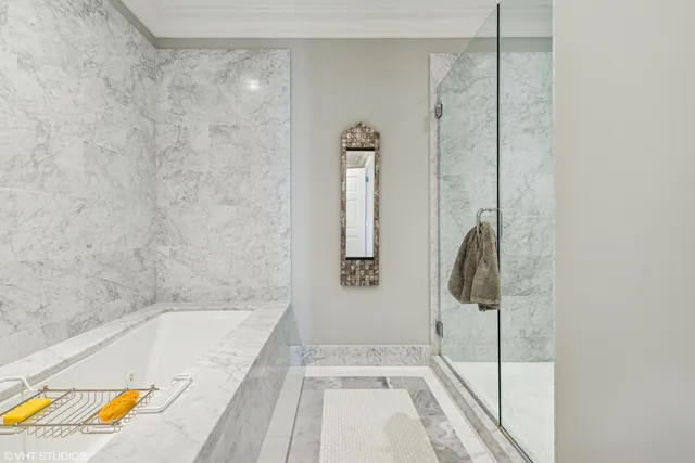 a bathroom with a tub and shower