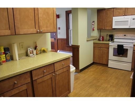 20 Marble Street Worcester, MA 01603 - Photo 25 of 30 a kitchen with stainless steel appliances a sink a stove and cabinets