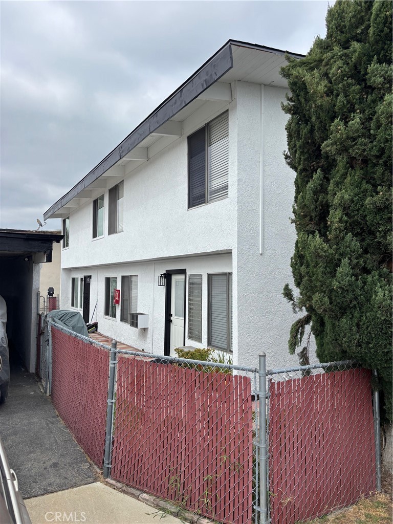 7160 Cerritos Avenue Stanton, CA 90680 - Photo 3 of 10 a view of a house with wooden deck and a yard