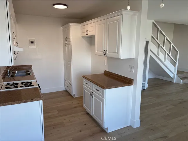a kitchen with a stove and a refrigerator