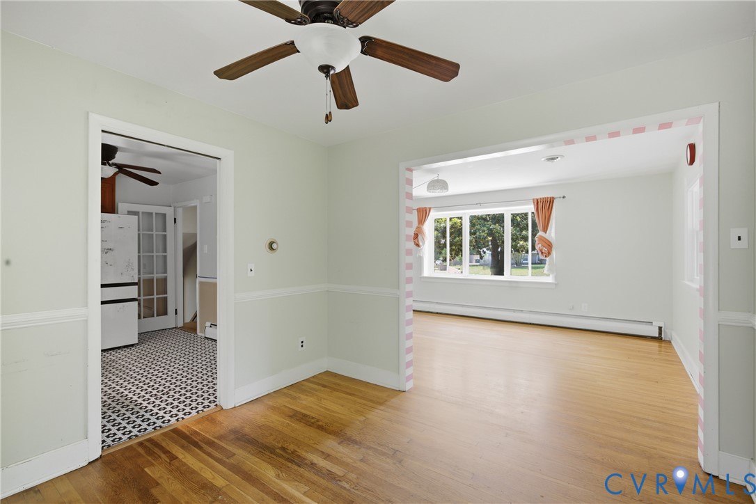 8210 Ireton Road Henrico, VA 23228 - Photo 8 of 36 wooden floor in an empty room with a window