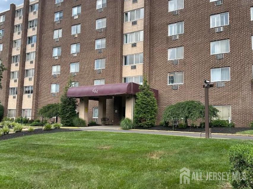 860 Lower Ferry Road, Unit 6D Ewing, NJ 08628 - Photo 1 of 40 a front view of a building with a garden