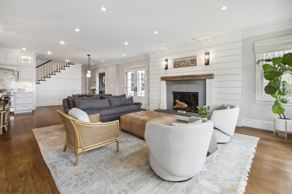 24 Greystone Road Marblehead, MA 01945 - Photo 18 of 42 a living room with furniture a fireplace and a table