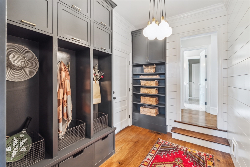 24 Greystone Road Marblehead, MA 01945 - Photo 21 of 42 a bedroom with a bed and a chandelier