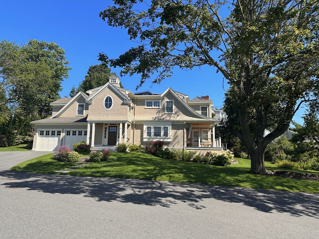 24 Greystone Road Marblehead, MA 01945 - Photo 3 of 42 a front view of a house with a garden and tree