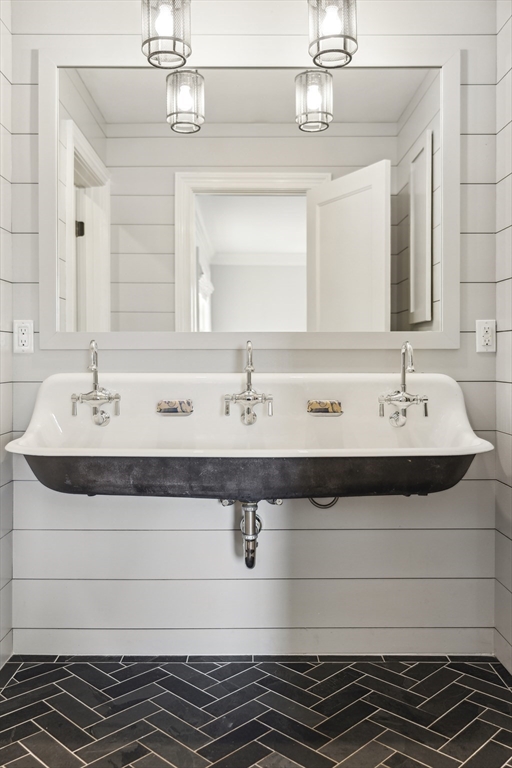 24 Greystone Road Marblehead, MA 01945 - Photo 34 of 42 a bathroom with a double vanity sink and a mirror