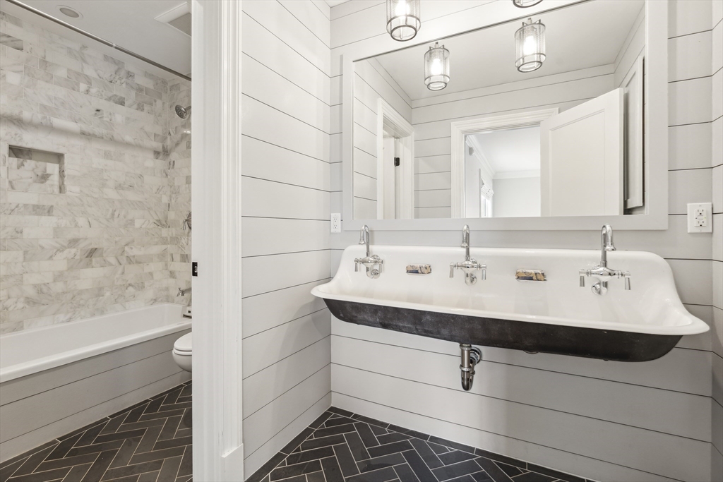 24 Greystone Road Marblehead, MA 01945 - Photo 35 of 42 a bathroom with a sink and a mirror
