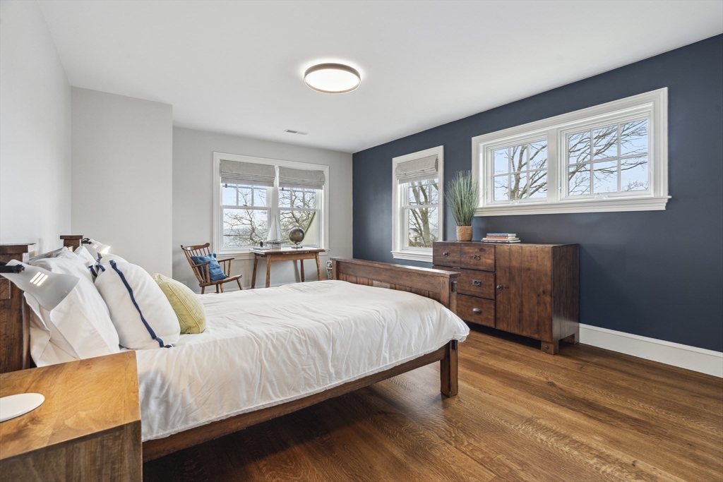 24 Greystone Road Marblehead, MA 01945 - Photo 37 of 42 a bedroom with a bed and wooden floor