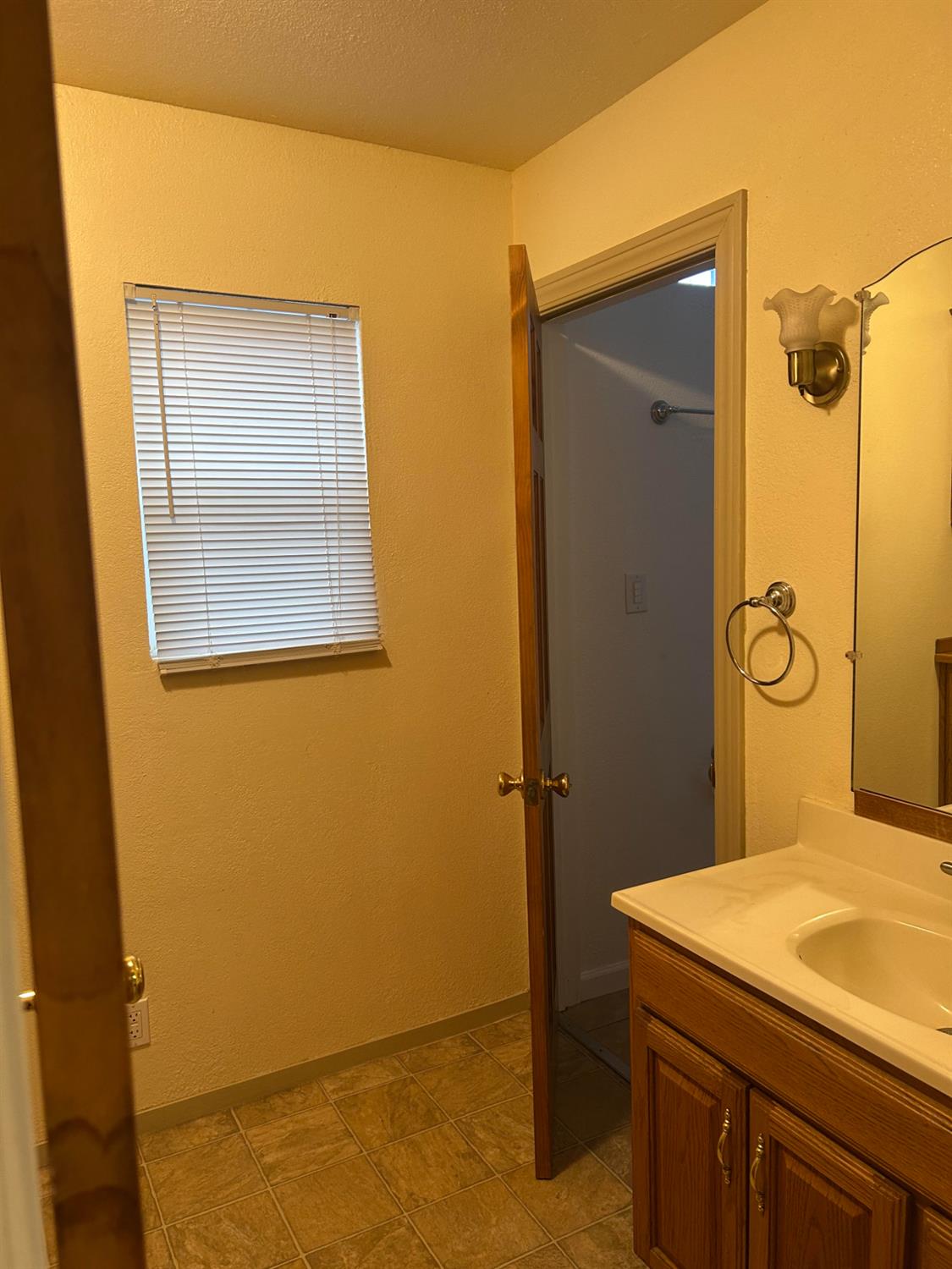 115 South Ione Street Ione, CA 95640 - Photo 12 of 15 a bathroom with a sink and a mirror