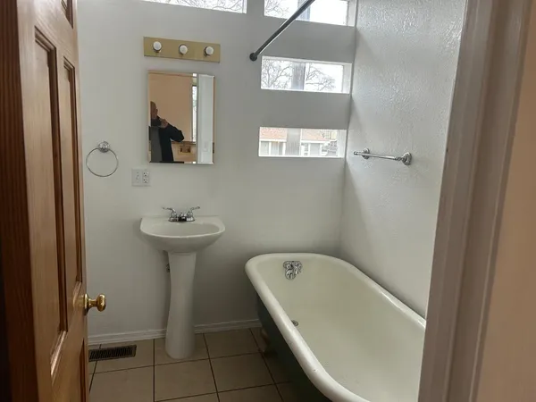 a view of a porch with wooden floor and stairs
