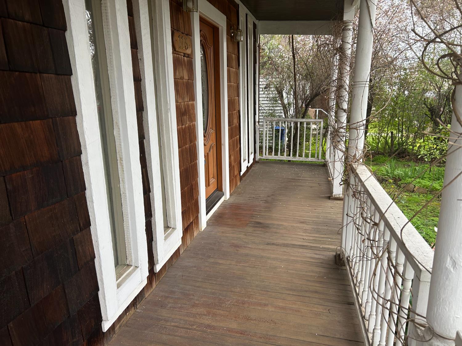 115 South Ione Street Ione, CA 95640 - Photo 15 of 15 a view of a porch with wooden floor and stairs