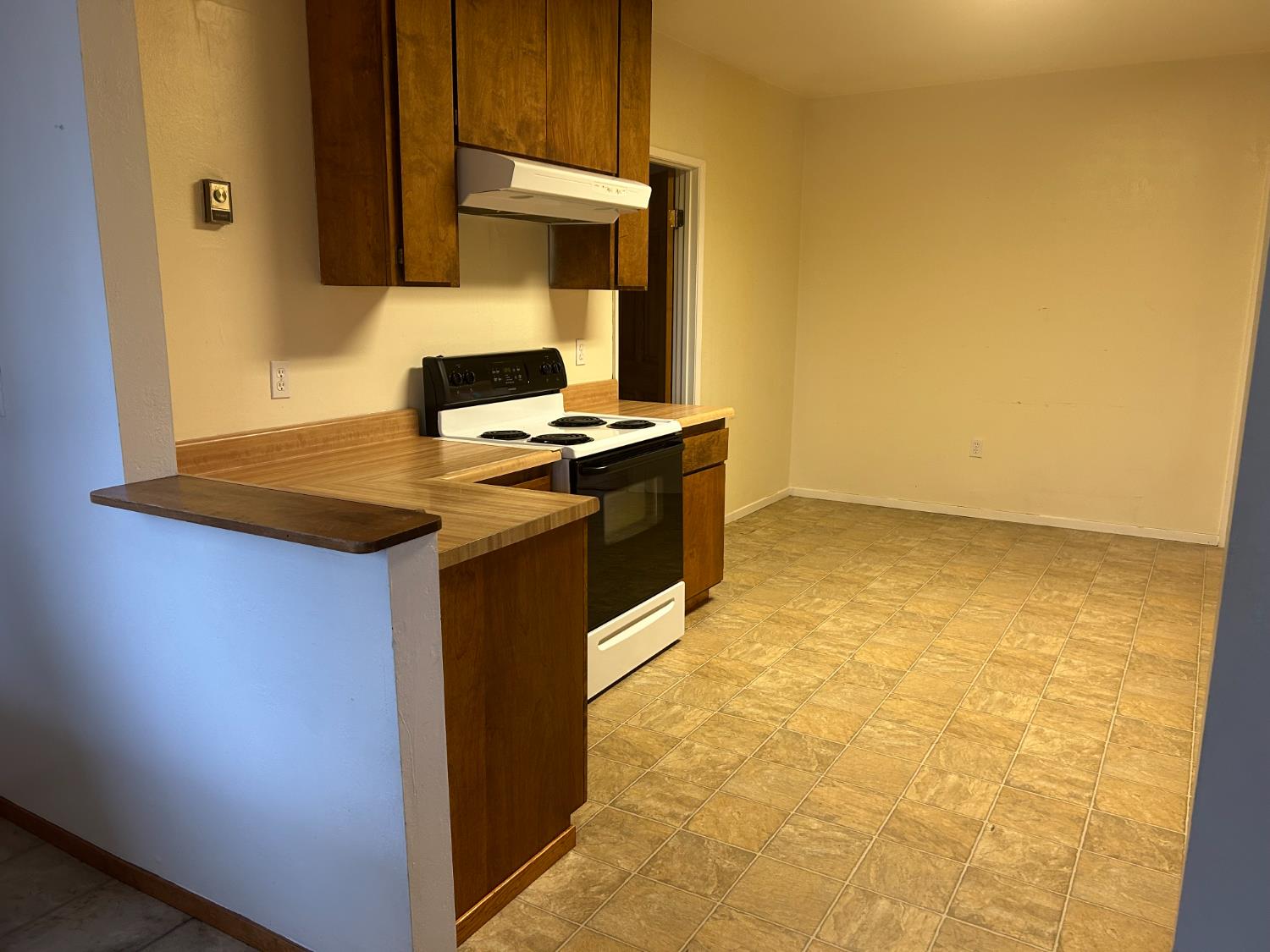115 South Ione Street Ione, CA 95640 - Photo 3 of 15 a kitchen with stainless steel appliances granite countertop a stove a sink and a microwave