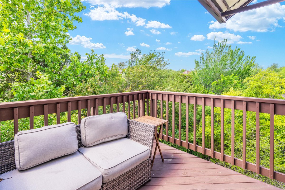 7701 Rialto Boulevard, Unit 91 Austin, TX 78735 - Photo 6 of 39 a roof deck with couches and wooden floor