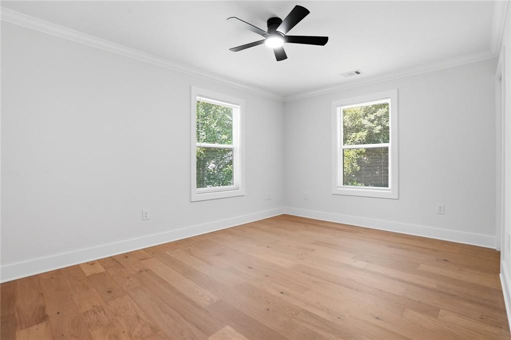 134 Henry Meyer Road Winterville, GA 30683 - Photo 24 of 34 wooden floor in an empty room with a window