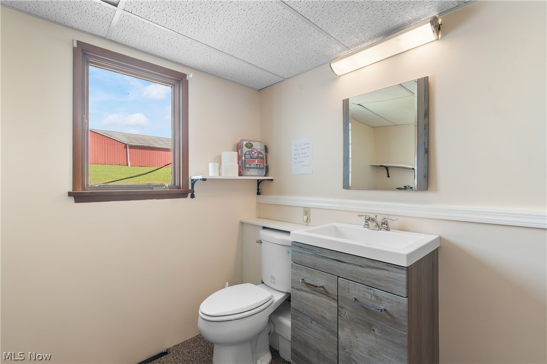 22840 Buck Road Alliance, OH 44601 - Photo 19 of 36 Bathroom featuring vanity and a drop ceiling