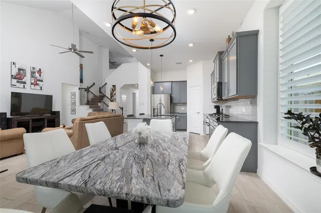 a bedroom with a bed couch and window