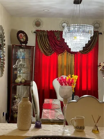 a view of entryway with dining table and chairs