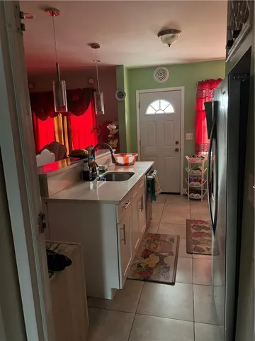 a kitchen with stainless steel appliances granite countertop a stove and a sink