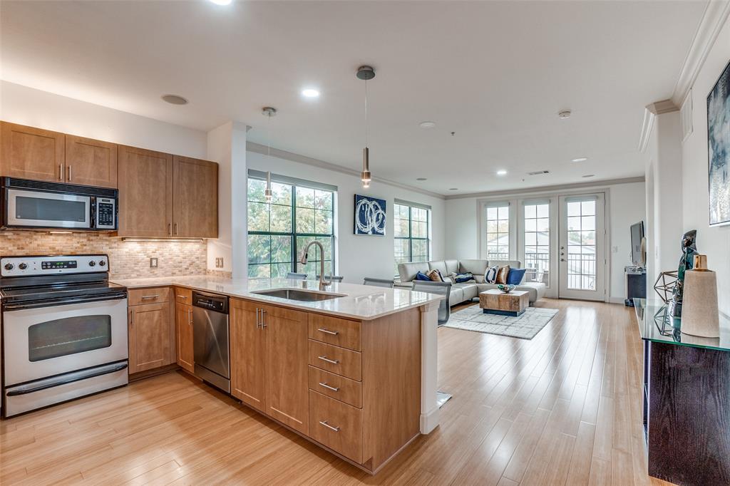3818 Holland Avenue, Unit 309 Dallas, TX 75219 - Photo 1 of 24 a view of a kitchen and dining room