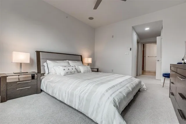 a bedroom with a bed and a lamp