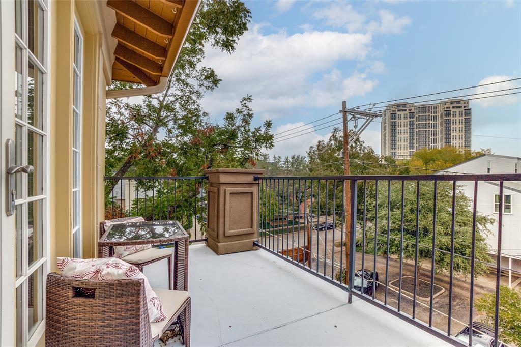 3818 Holland Avenue, Unit 309 Dallas, TX 75219 - Photo 19 of 24 a balcony view with a couch