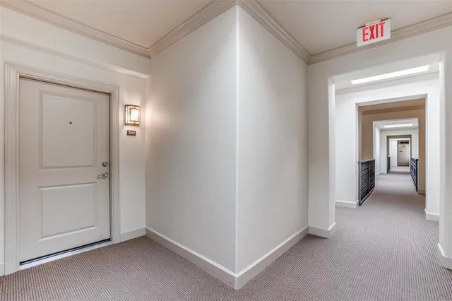 a view of a livingroom and a hallway