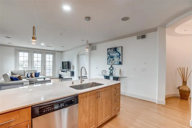 a kitchen with sink refrigerator and window