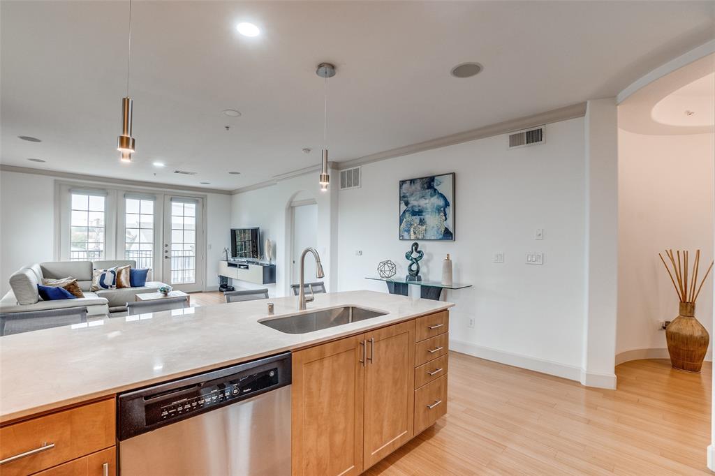 3818 Holland Avenue, Unit 309 Dallas, TX 75219 - Photo 6 of 24 a kitchen with sink refrigerator and window