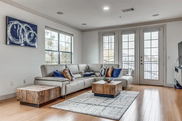 a living room with furniture and a rug