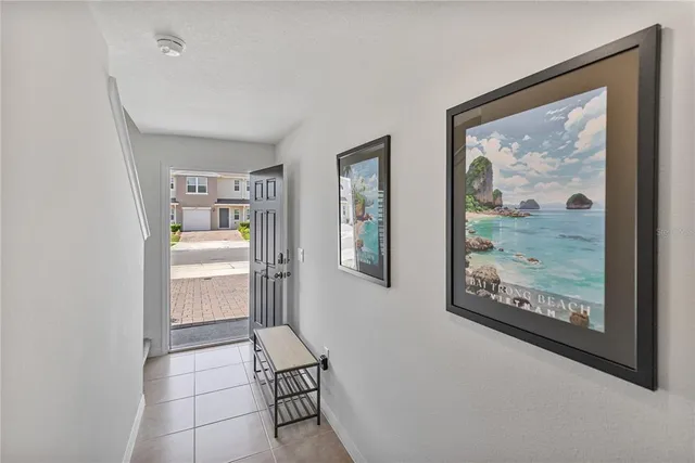 a bedroom with a bed and a night stand