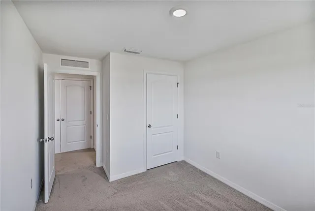 a view of an entrance to house with yard