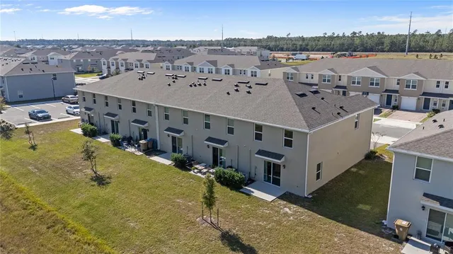 an outdoor space with swimming pool and mountain view