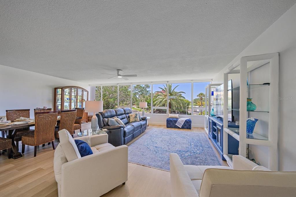 100 Sands Point Road, Unit 225 Longboat Key, FL 34228 - Photo 30 of 41 a living room with furniture and a large window