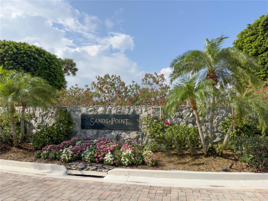 100 Sands Point Road, Unit 225 Longboat Key, FL 34228 - Photo 3 of 41 a view of a garden with flowers