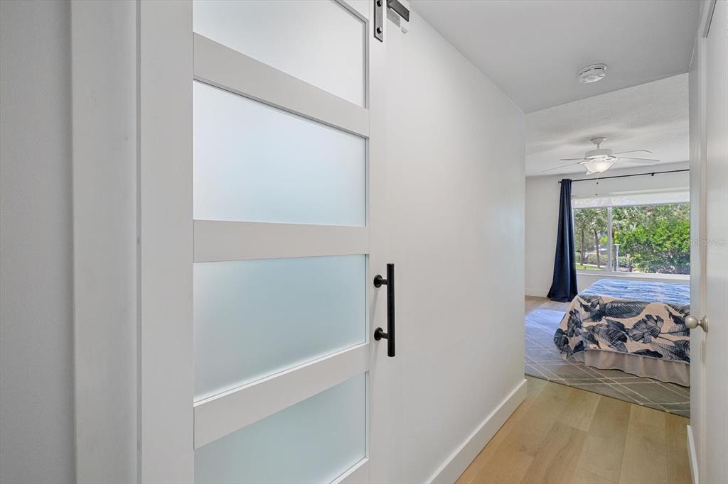 100 Sands Point Road, Unit 225 Longboat Key, FL 34228 - Photo 10 of 41 a bedroom with a bed and a window