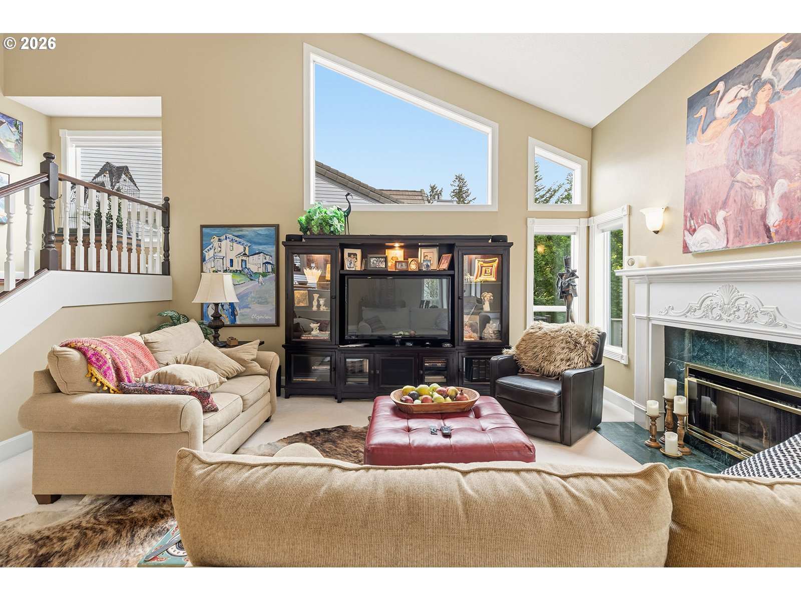 15917 Northeast Union Road, Unit 16 Ridgefield, WA 98642 - Photo 19 of 47 a living room with furniture a fireplace and a large window