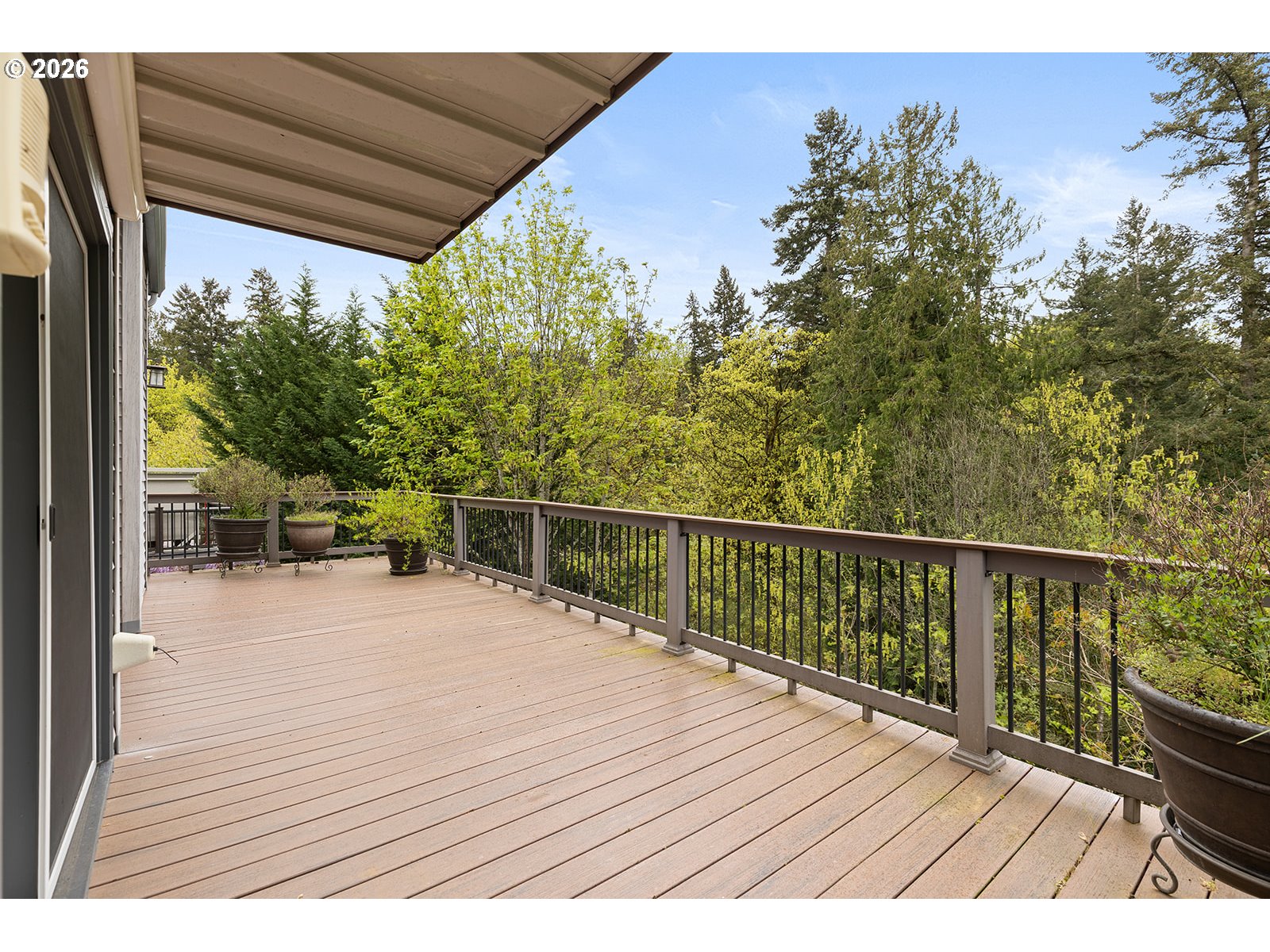 15917 Northeast Union Road, Unit 16 Ridgefield, WA 98642 - Photo 34 of 47 a balcony with wooden floor and fence