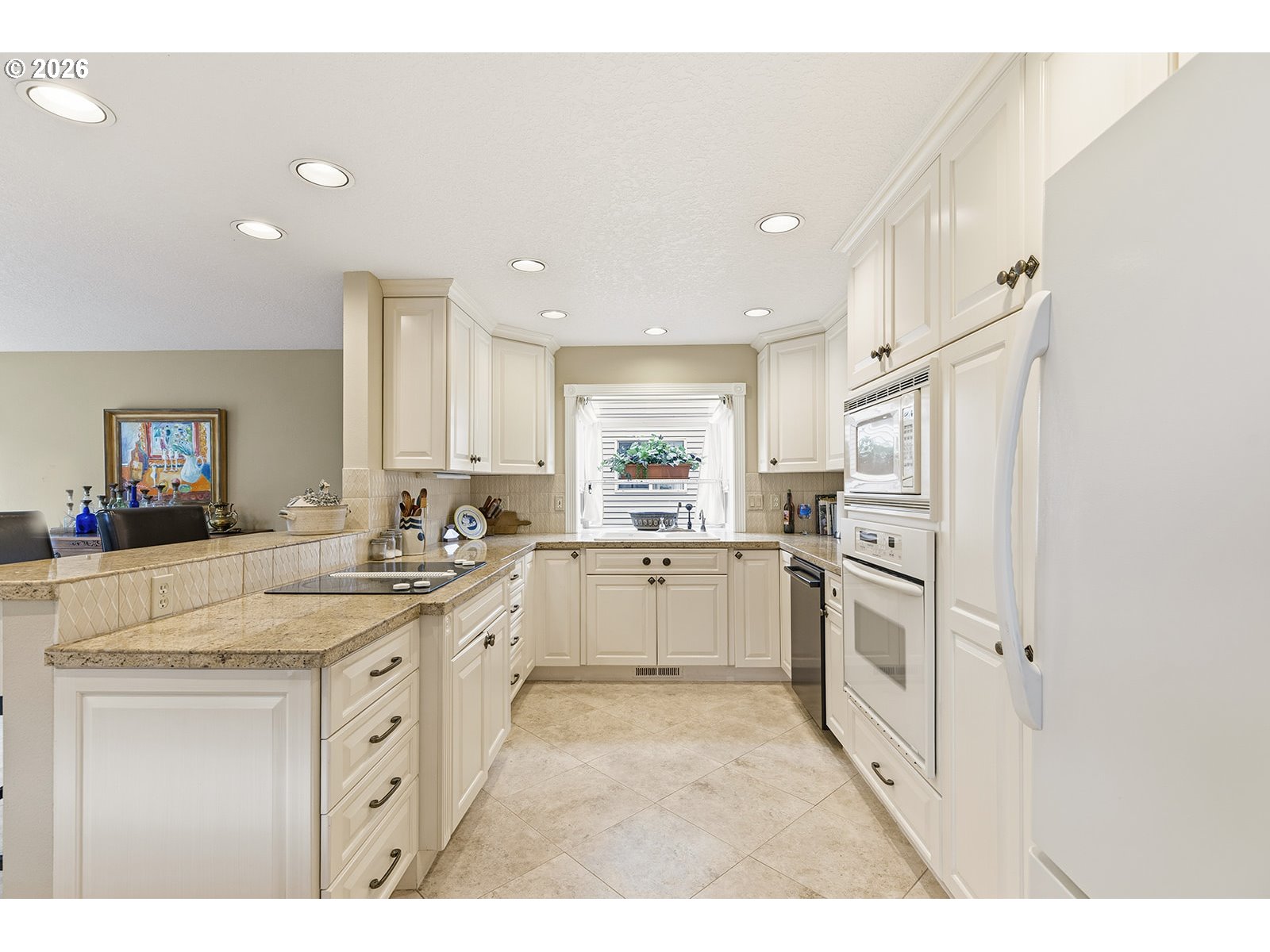 15917 Northeast Union Road, Unit 16 Ridgefield, WA 98642 - Photo 9 of 47 a kitchen with white cabinets and white appliances