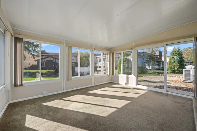 a swimming pool in front of a house